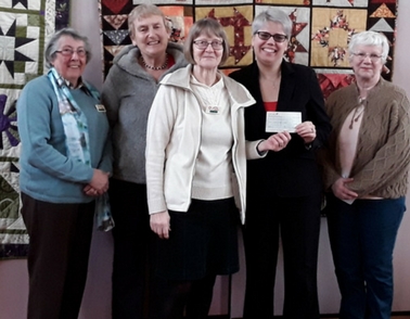 Donation from Kettering Quilters is a welcome boost for dementia patients