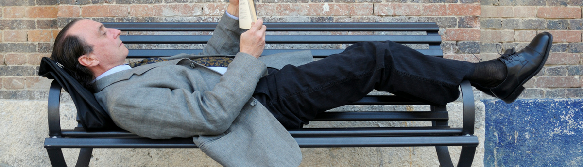 Man relaxing on bench 1200x345